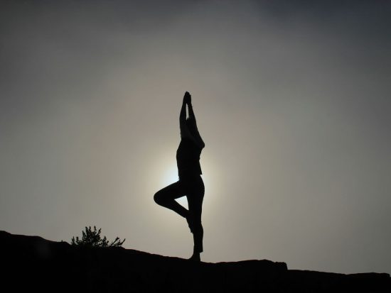 person doing yoga exercises