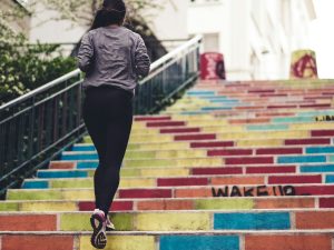 woman running upstair in room