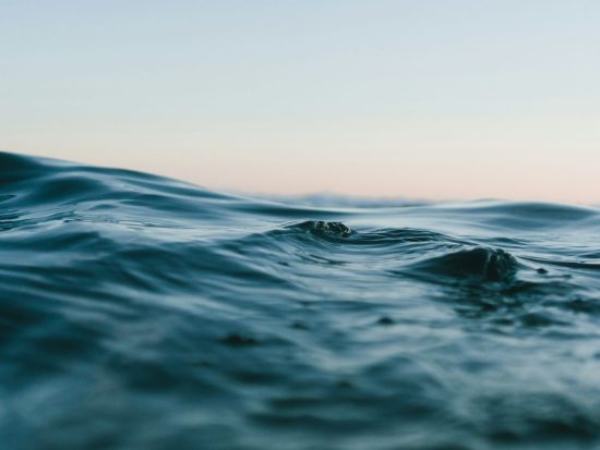 body of water under sky