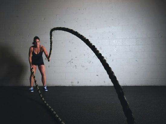 woman holding brown ropes